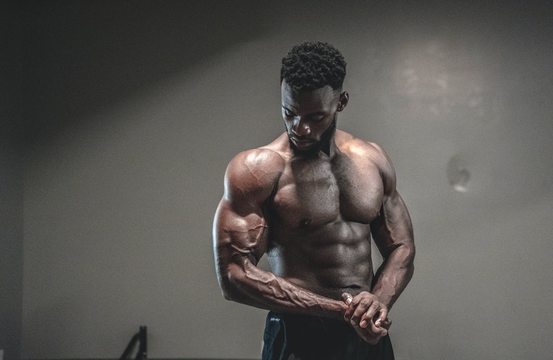A vascular bodybuilder flexing his biceps