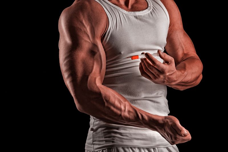 man injecting steroids